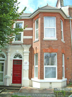 External photograph of one of our properties with a red door